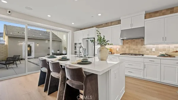 a kitchen with a table and chairs in it