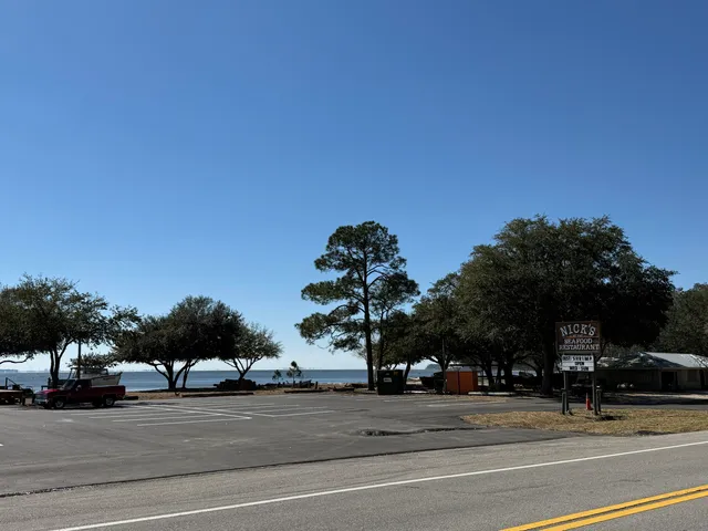 a view of a car parked in the road