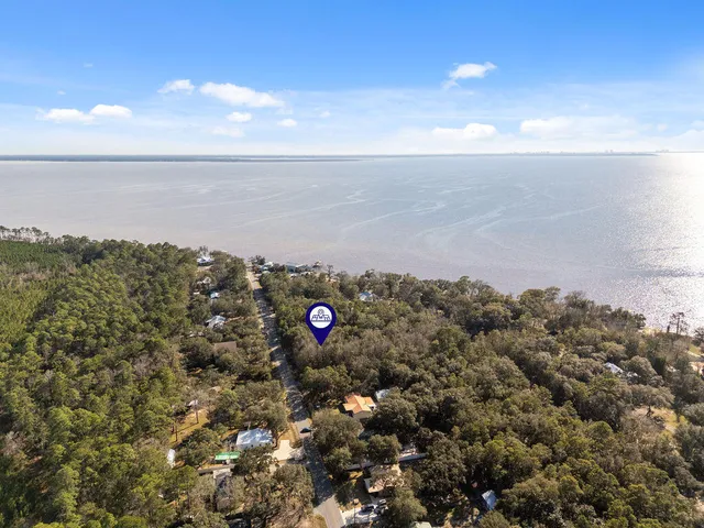 a view of a backyard of the house