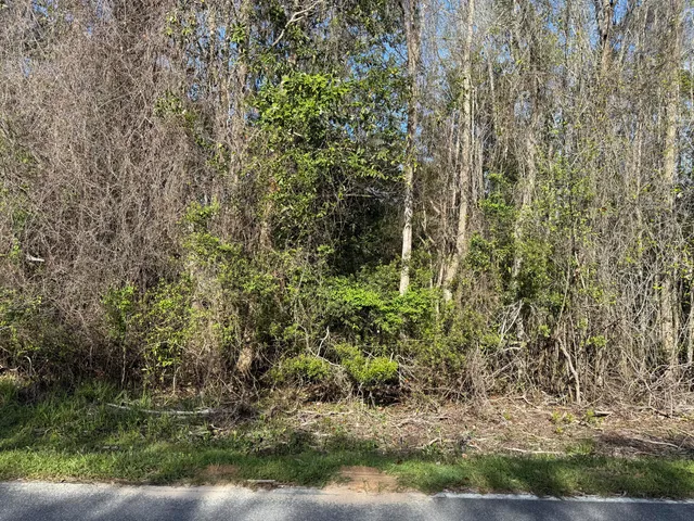 a swimming pool with outdoor seating and yard