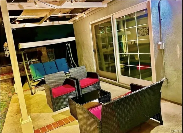 a outdoor living space with furniture and a potted plant