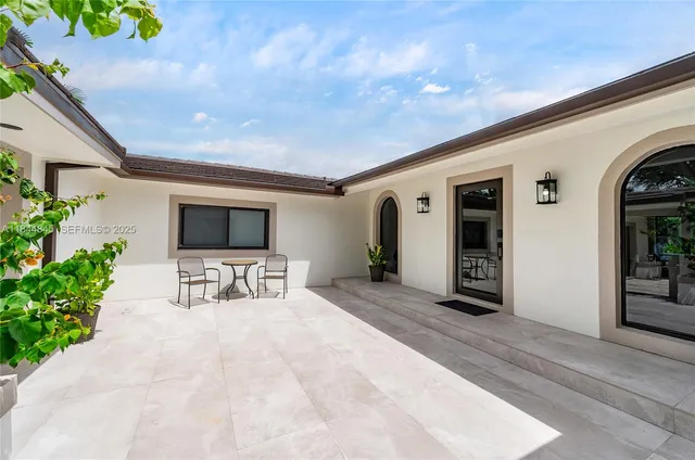 a lobby with furniture and a potted plant