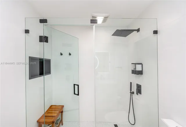 a bedroom with a bed and flat screen tv