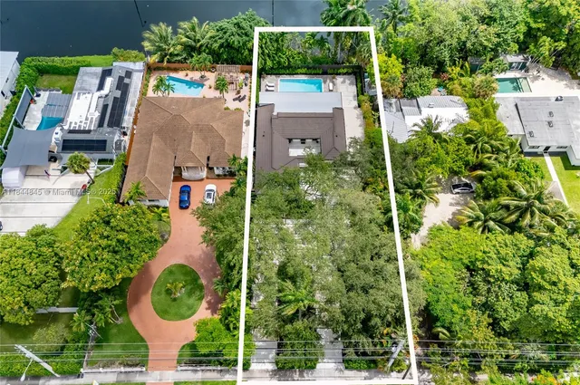 an aerial view of house with a yard