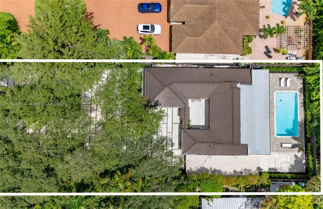 an aerial view of house with a yard