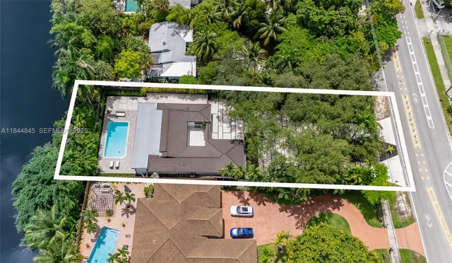 an aerial view of multiple houses with yard