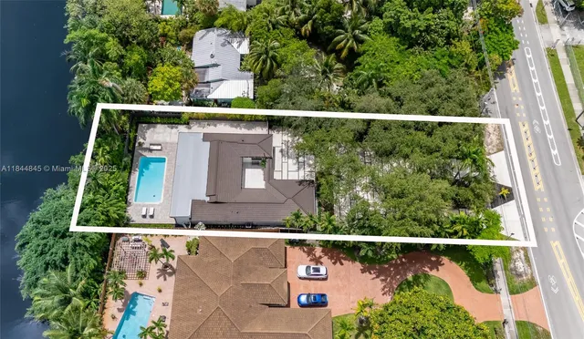 an aerial view of multiple houses with yard