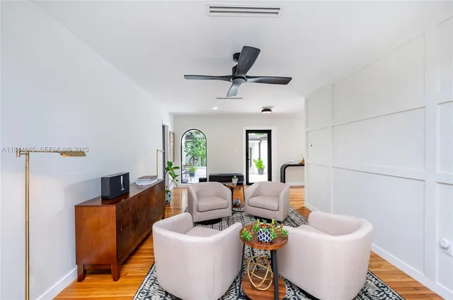 a living room with furniture and a window