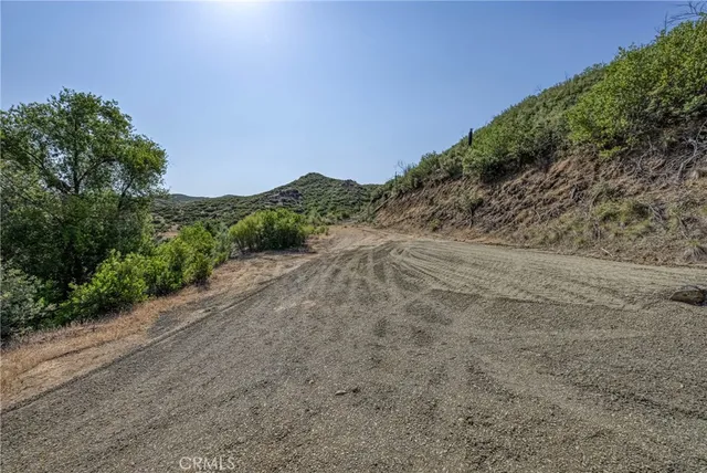 a view of a road with a mountain in the background