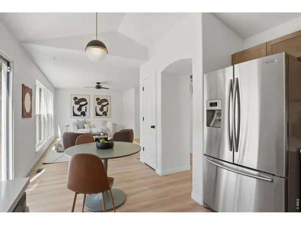 a kitchen with stainless steel appliances a refrigerator and a stove