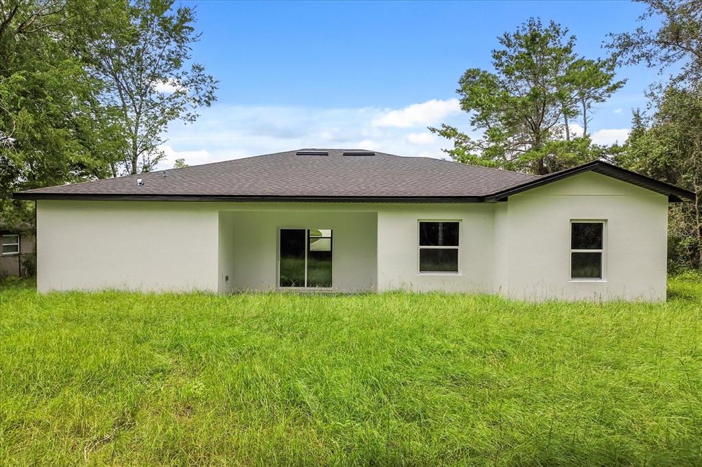 2097 Southwest 153rd Loop Ocala, FL 34481 - Photo 11 of 39 a house that has a lot of plants in it