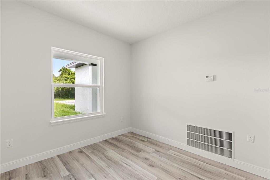 2097 Southwest 153rd Loop Ocala, FL 34481 - Photo 21 of 39 an empty room with windows