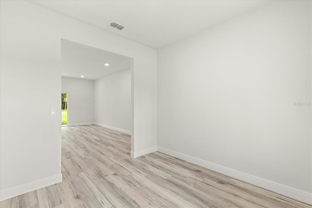 2097 Southwest 153rd Loop Ocala, FL 34481 - Photo 22 of 39 a view of an empty room and wooden floor