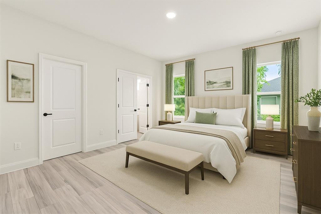 2097 Southwest 153rd Loop Ocala, FL 34481 - Photo 26 of 39 a bedroom with a bed and a window