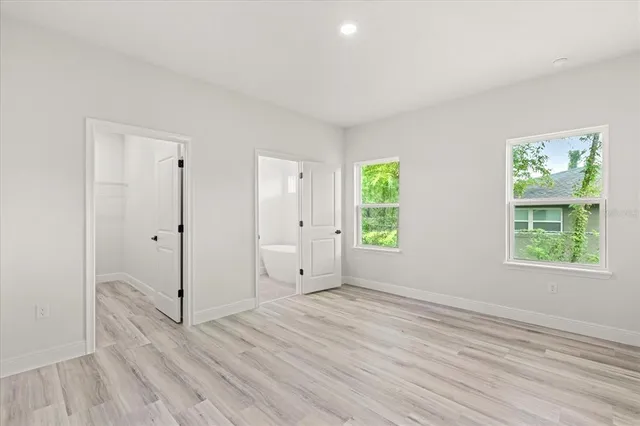 a bathroom with a double vanity sink and mirror
