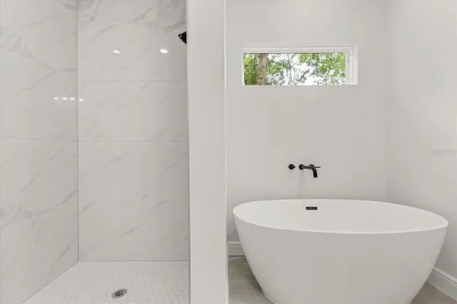 a bathroom with a toilet and shower