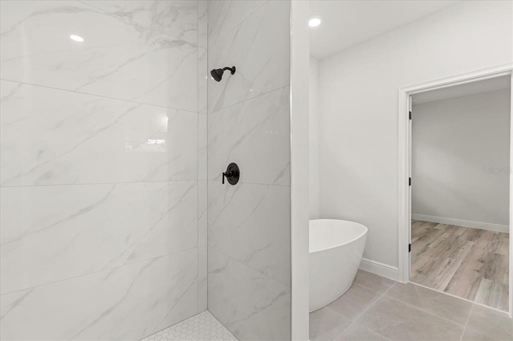 2097 Southwest 153rd Loop Ocala, FL 34481 - Photo 30 of 39 a bathroom with a toilet and shower