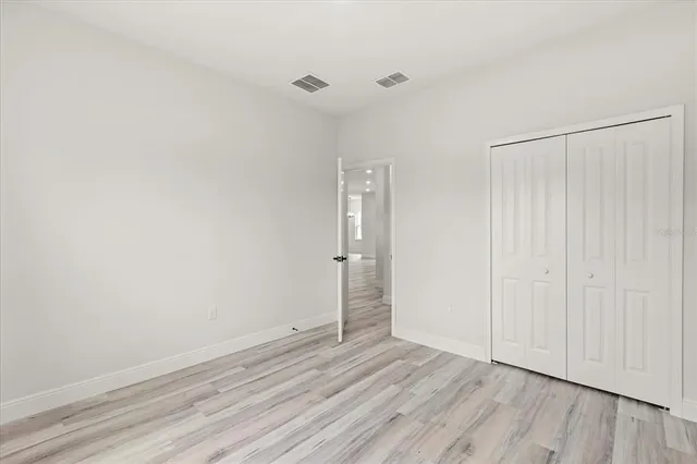 a bathroom with a granite countertop sink a toilet and bathtub