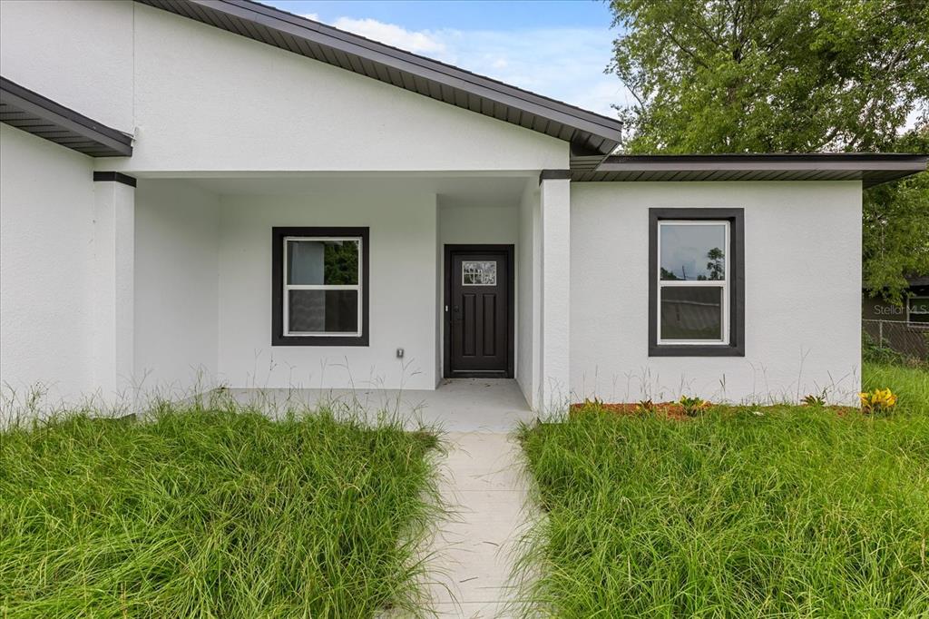2097 Southwest 153rd Loop Ocala, FL 34481 - Photo 4 of 39 a house view with a garden space