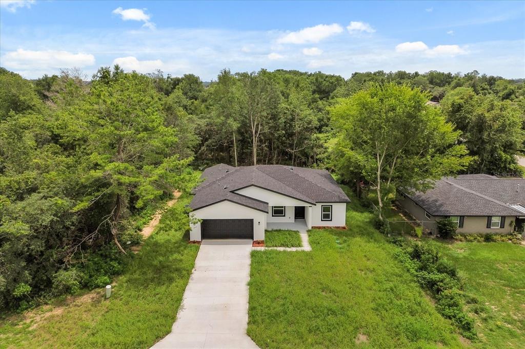 2097 Southwest 153rd Loop Ocala, FL 34481 - Photo 5 of 39 a aerial view of a house with a yard