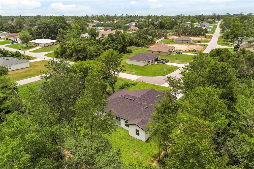 2097 Southwest 153rd Loop Ocala, FL 34481 - Photo 7 of 39 an aerial view of residential houses with outdoor space and trees