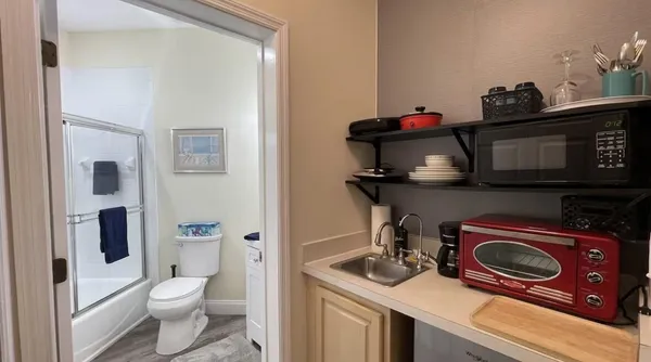 a view of a bathroom with a sink and a washer