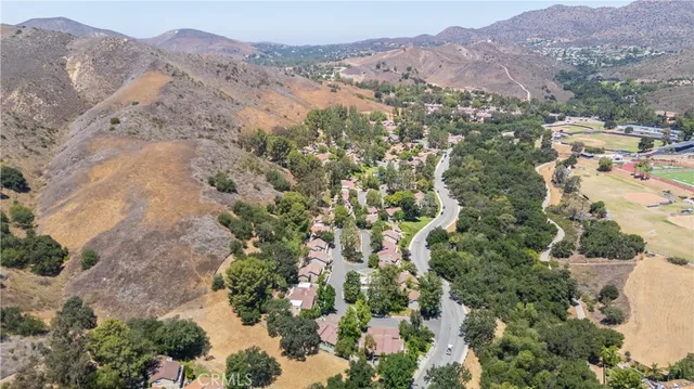 a view of a city with mountains in the background