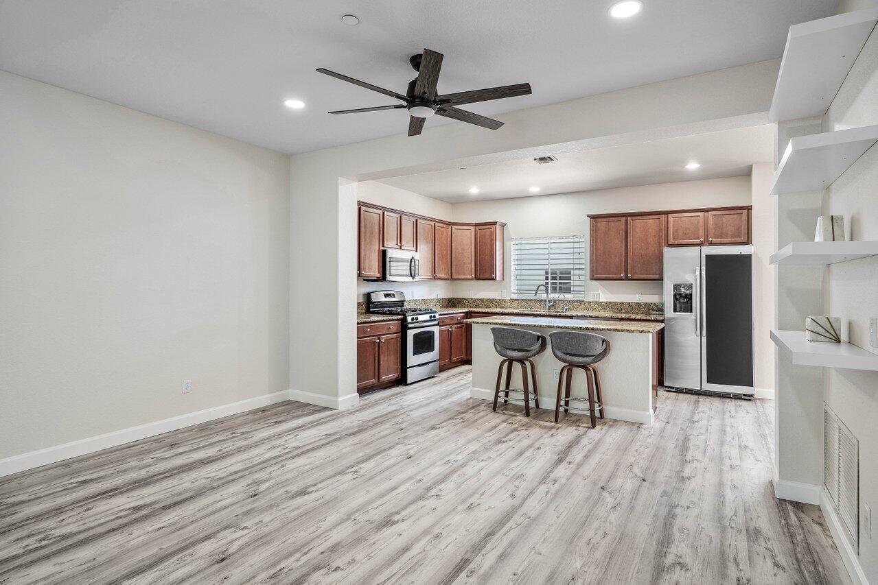 48 Northwest Hawthorne Place Boca Raton, FL 33432 - Photo 15 of 35 Living Room and Kitchen