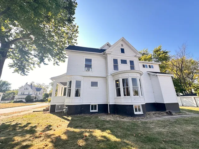 a house that has a big yard in front of it