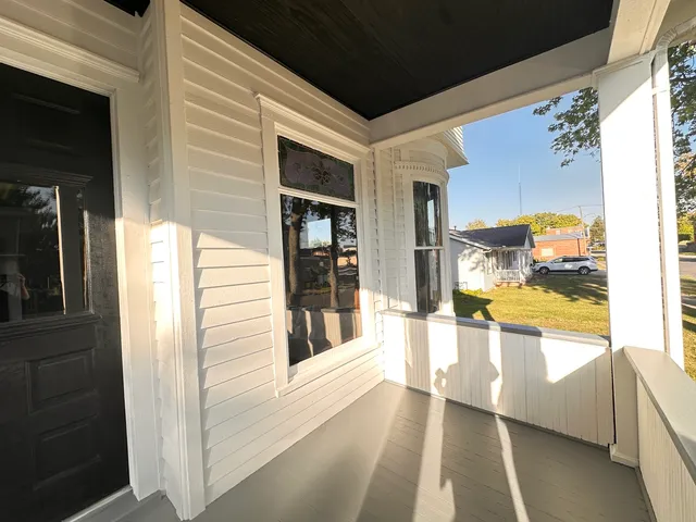 a view of a living room with a large window