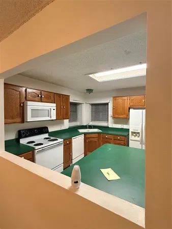 a room with wooden floor and staircase
