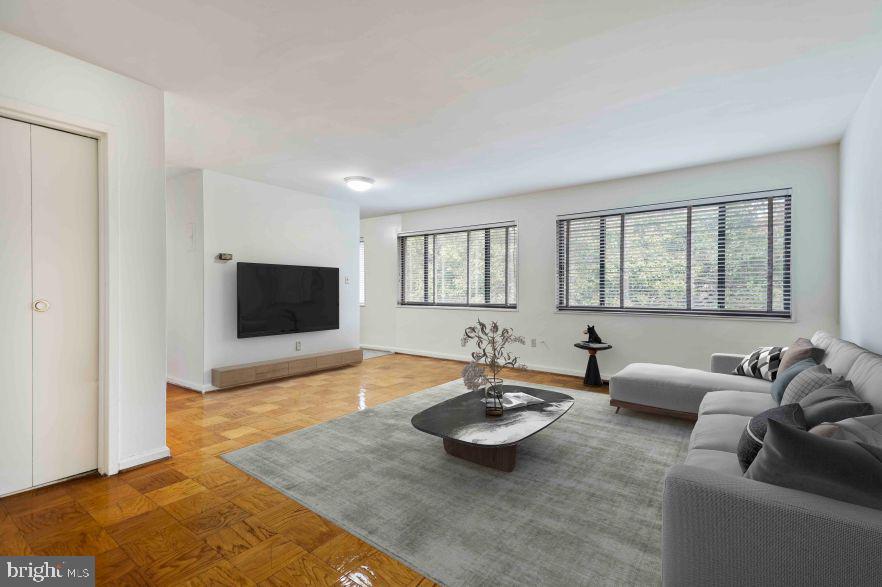 1920 North Calvert Street, Unit 1 BR 1 Arlington, VA 22201 - Photo 4 of 9 a living room with furniture and a flat screen tv