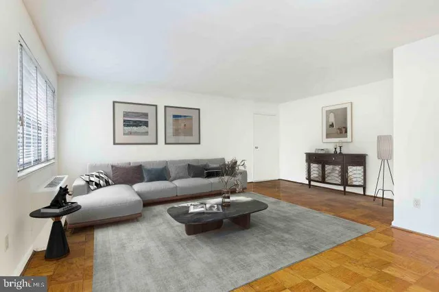 a bedroom with a bed and a large mirror