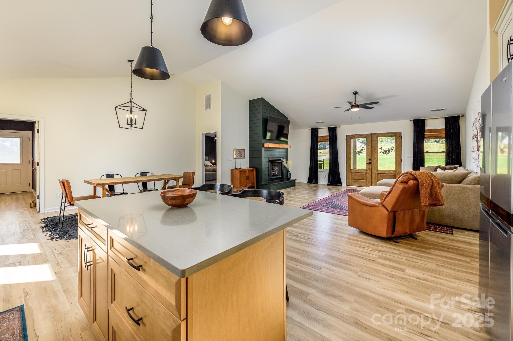 2256 Bolton Road Catawba, NC 28609 - Photo 12 of 48 a living room with kitchen island furniture and a wooden floor