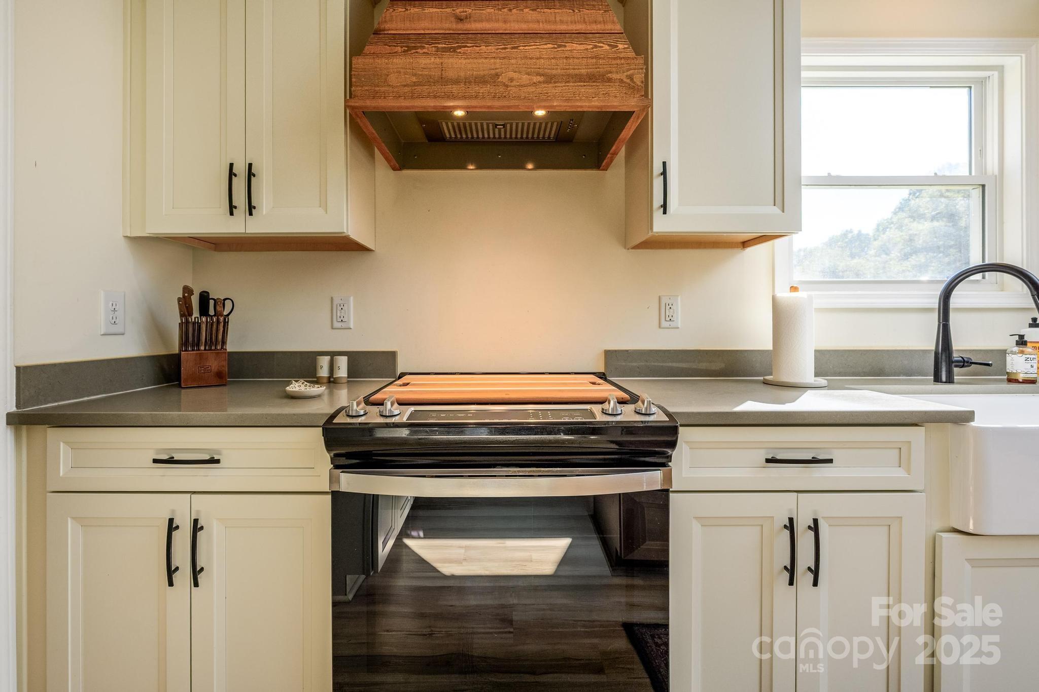 2256 Bolton Road Catawba, NC 28609 - Photo 17 of 48 a kitchen with a stove and white cabinets