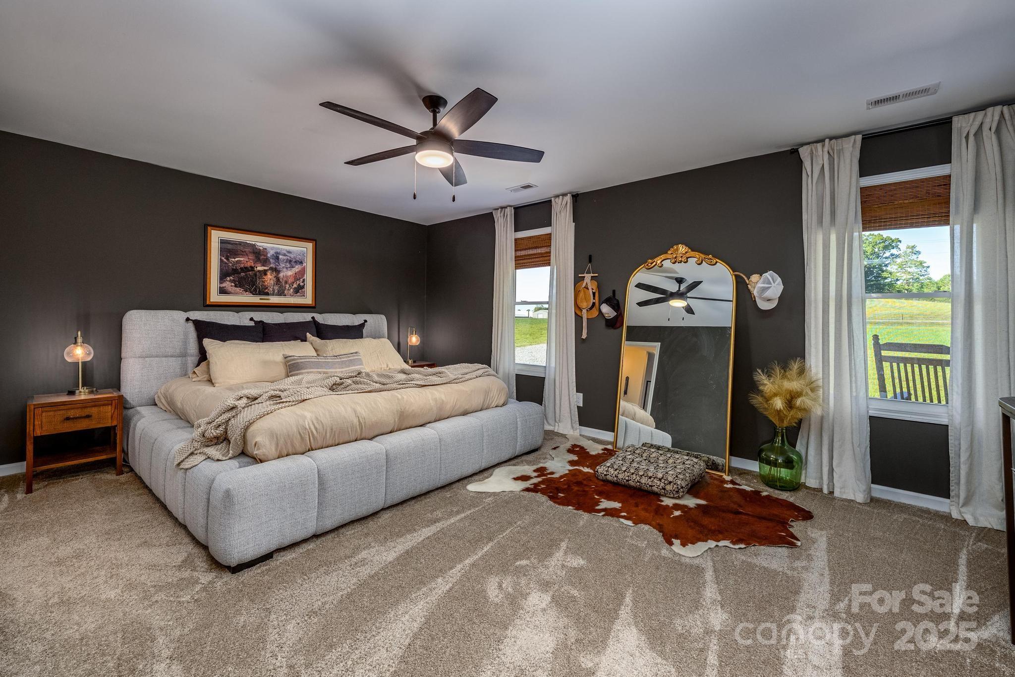 2256 Bolton Road Catawba, NC 28609 - Photo 20 of 48 a bedroom with a bed and a chandelier