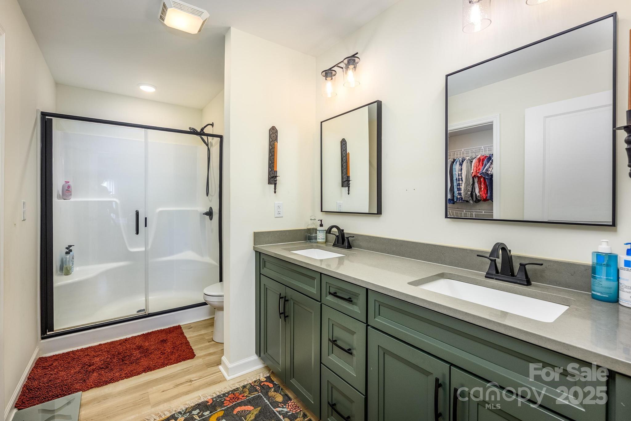 2256 Bolton Road Catawba, NC 28609 - Photo 23 of 48 a bathroom with a double vanity sink mirror and shower