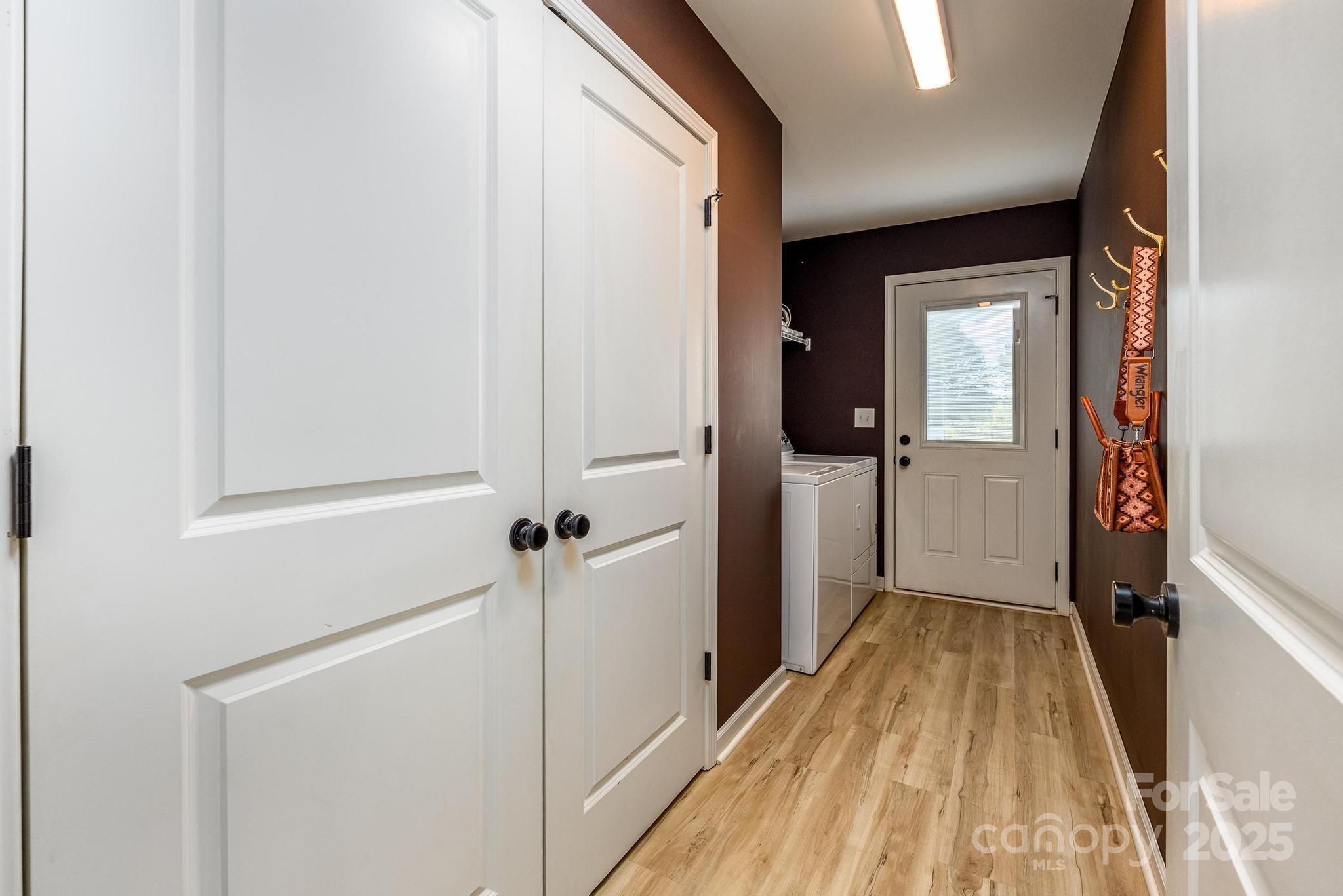 2256 Bolton Road Catawba, NC 28609 - Photo 25 of 48 a view of a hallway with wooden floor and a bathroom