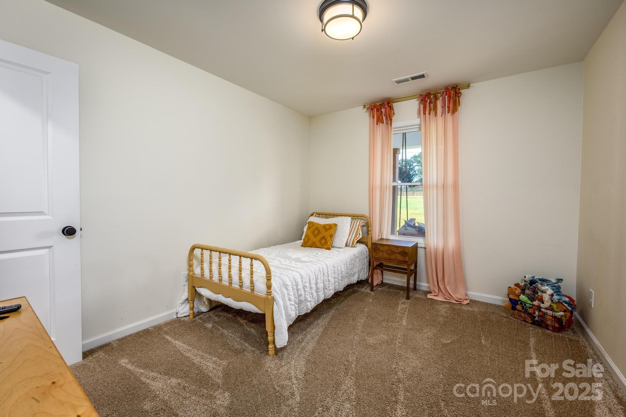 2256 Bolton Road Catawba, NC 28609 - Photo 32 of 48 a bed room with a bed and a chair