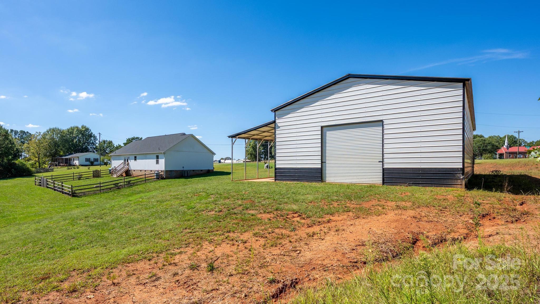 2256 Bolton Road Catawba, NC 28609 - Photo 36 of 48 a backyard of a house with table and chairs