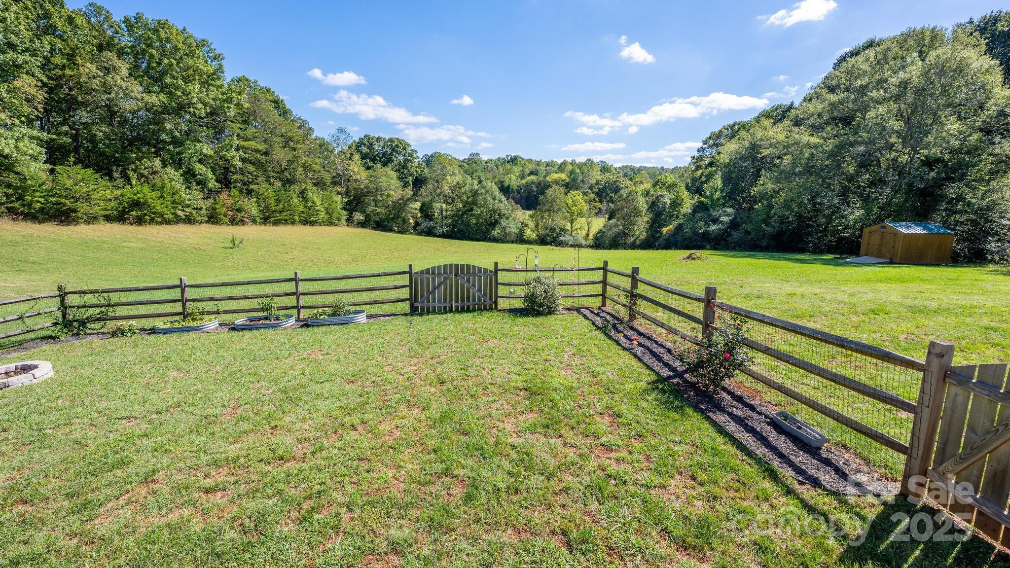 2256 Bolton Road Catawba, NC 28609 - Photo 4 of 48 a view of a yard with wooden fence