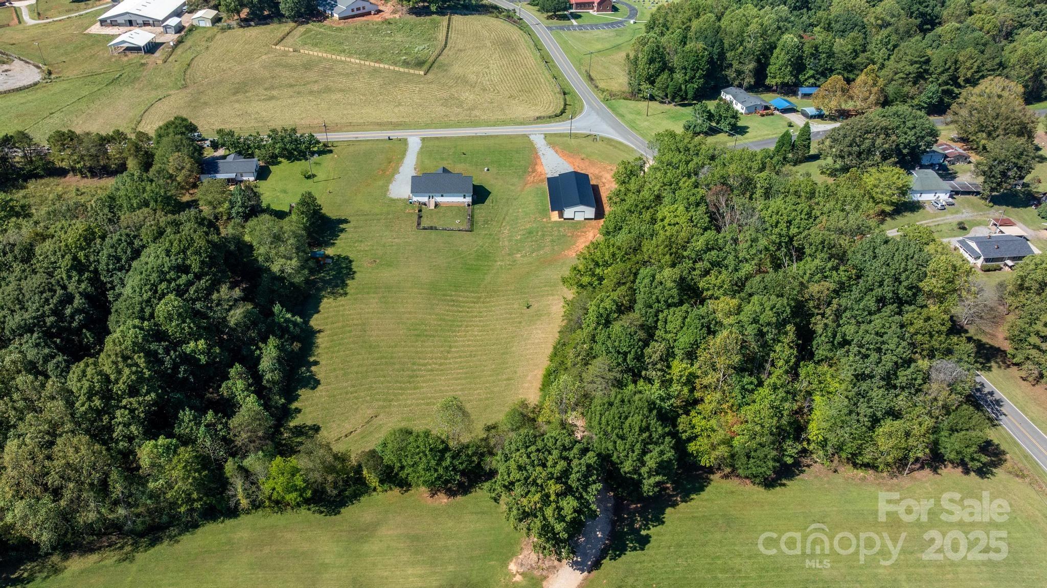 2256 Bolton Road Catawba, NC 28609 - Photo 41 of 48 a view of a lake with a yard