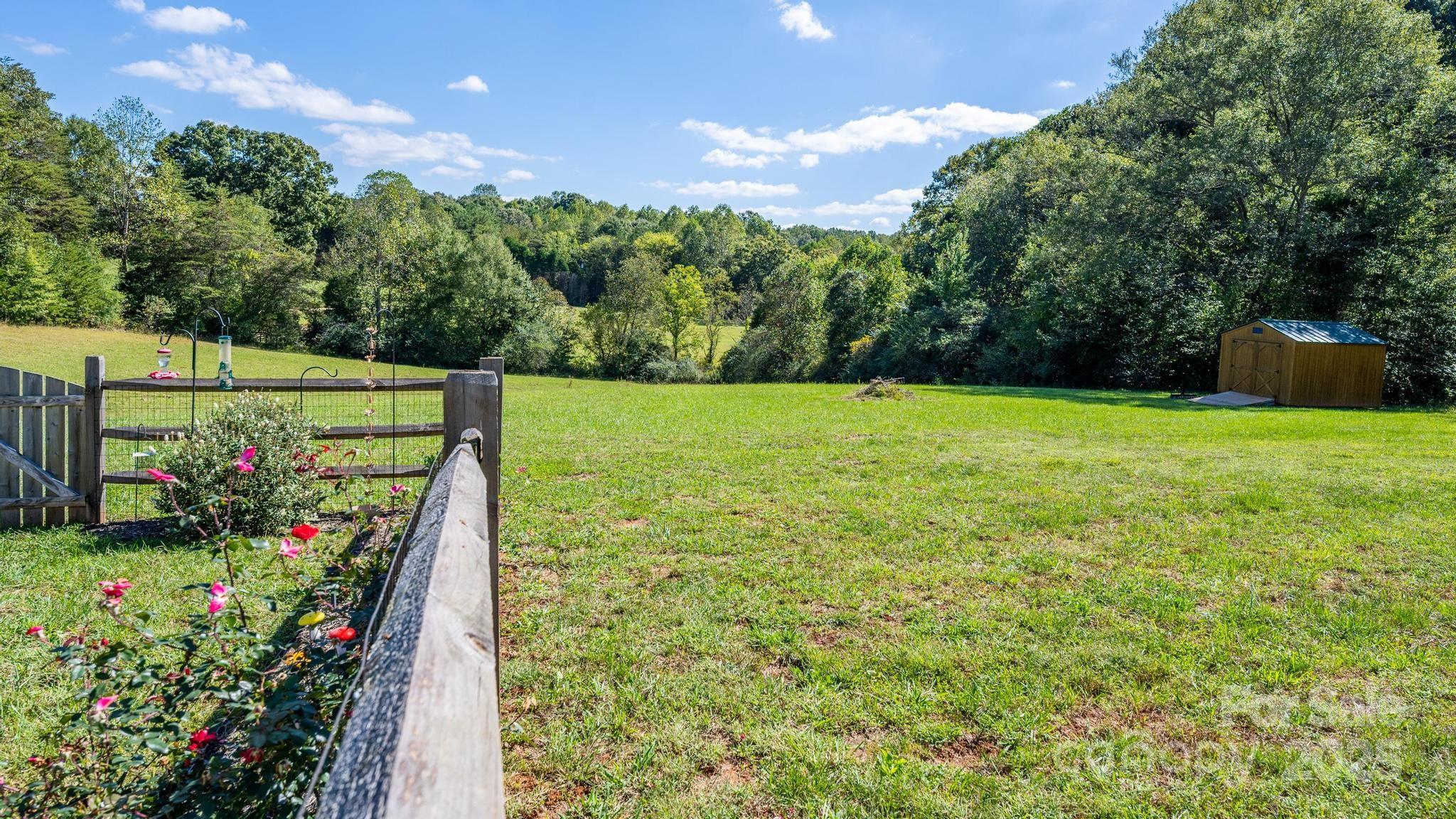 2256 Bolton Road Catawba, NC 28609 - Photo 45 of 48 a view of a garden with plants and large trees