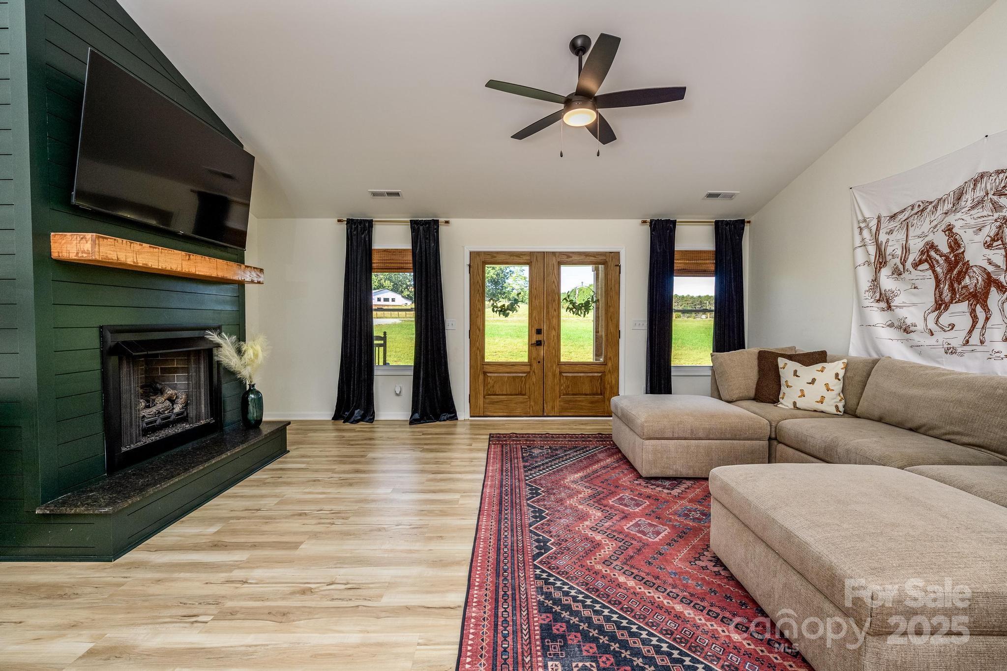 2256 Bolton Road Catawba, NC 28609 - Photo 9 of 48 a living room with furniture flat screen tv and a fireplace