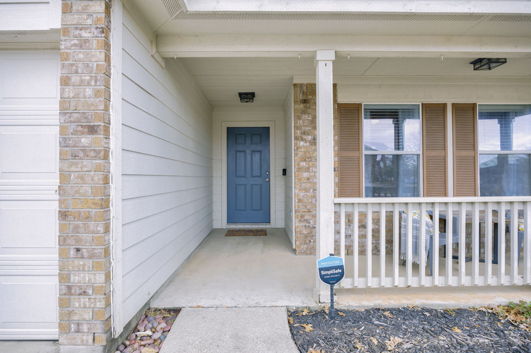 304 Old Peak Road Georgetown, TX 78626 - Photo 3 of 40 Entrance to property with a porch, brick siding, and a garage