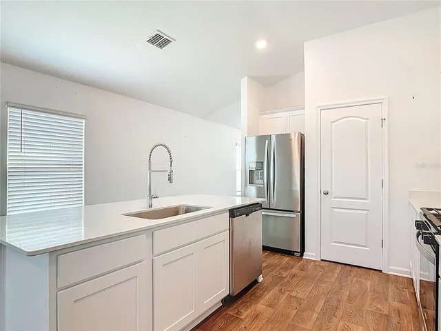 a view of a room with sliding glass door and mountain view