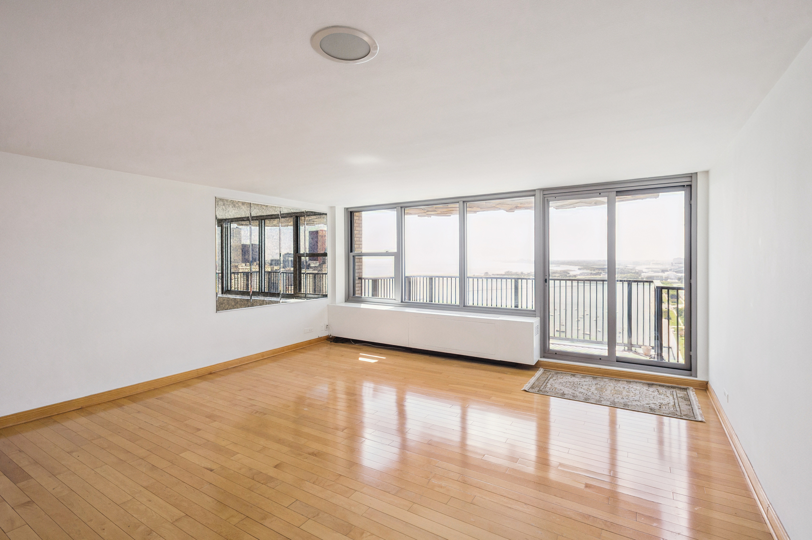 400 East Randolph Street, Unit 3905 Chicago, IL 60601 - Photo 12 of 55 wooden floor in an empty room with a window