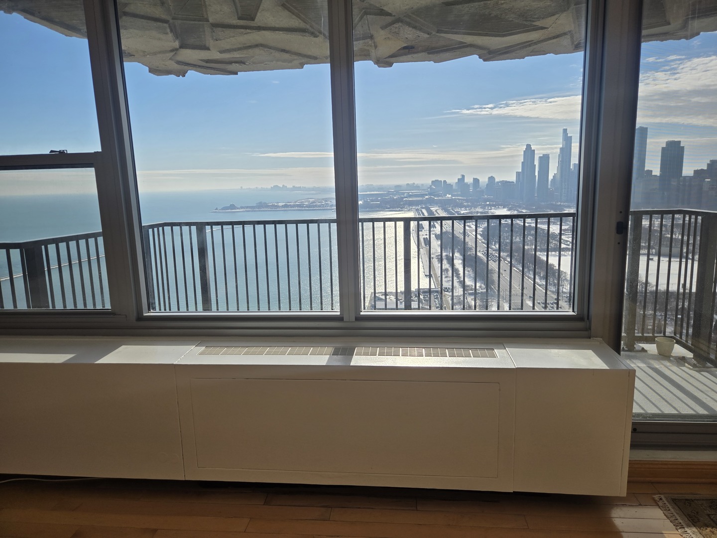400 East Randolph Street, Unit 3905 Chicago, IL 60601 - Photo 3 of 55 a living room with a large window