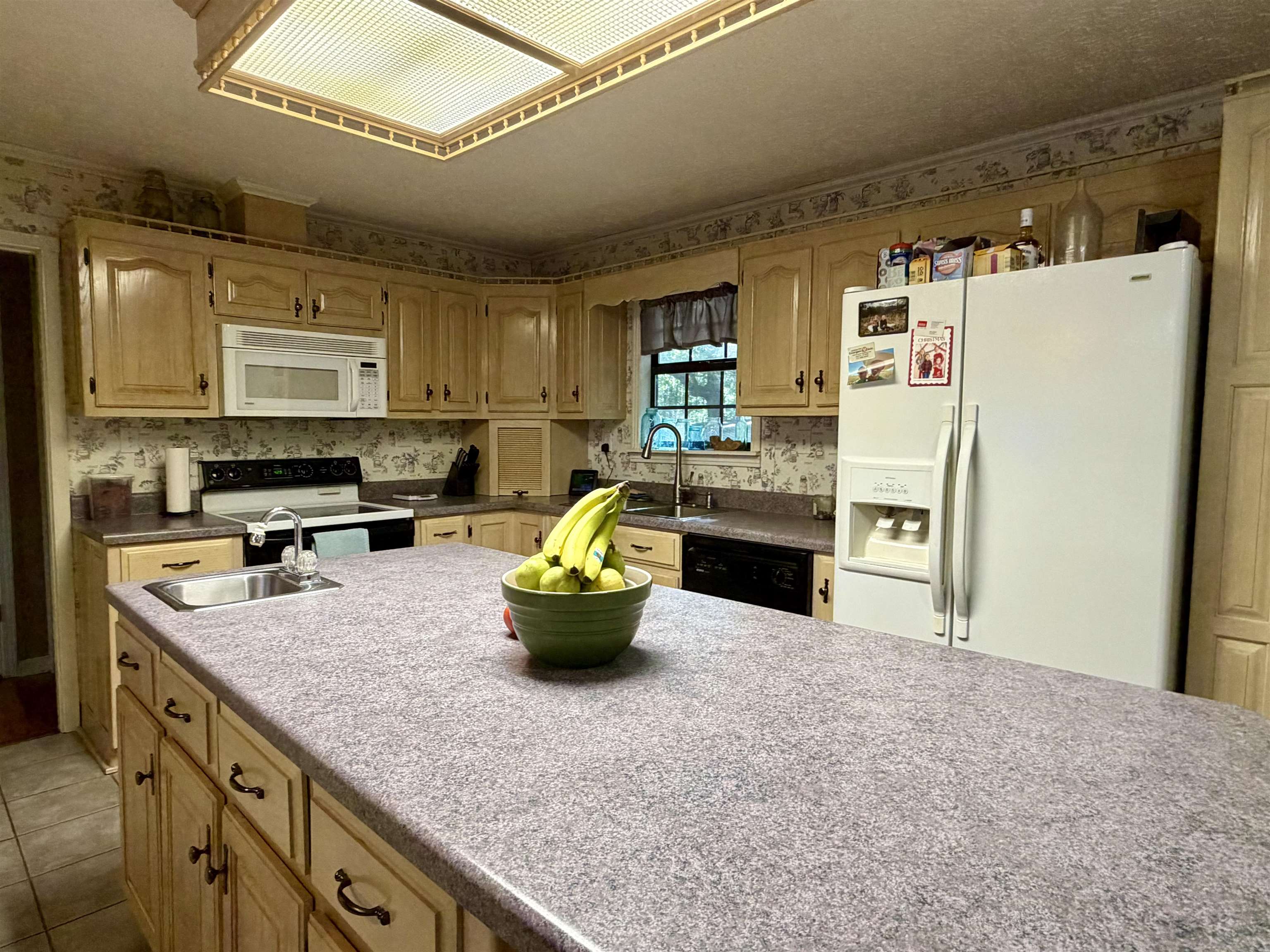 373 Clarence Barham Road Bethel Springs, TN 38315 - Photo 8 of 28 Kitchen featuring an expansive center island with an integrated sink