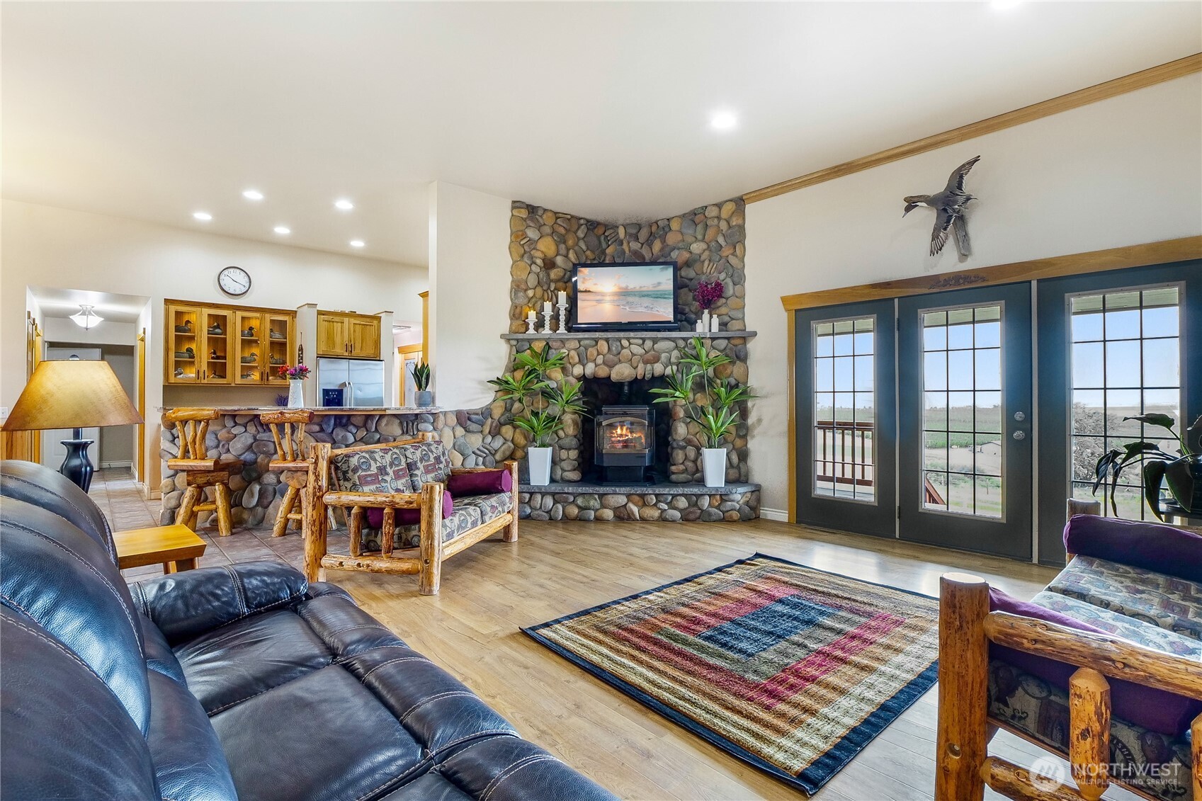 201 Vanderbilt Road Ellensburg, WA 98926 - Photo 18 of 40 a living room with furniture a rug and a fireplace